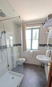 a bathroom with a shower and a toilet and a sink at Villa Parma in Maribor Self check - in in Maribor