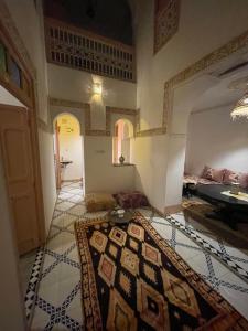 a living room with a rug on the floor at Riad Marrakech Palacito in Marrakesh