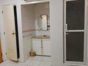 a bathroom with a sink and a mirror at Dream Garden Hotel in Solano +34 photos