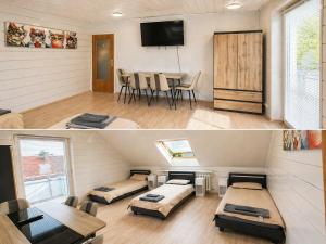 a room with two beds and a dining room at Kurzzeitvermitung Angelov in Hameln