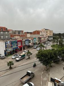 a city with cars parked on a street at appartement cozy in Kolea