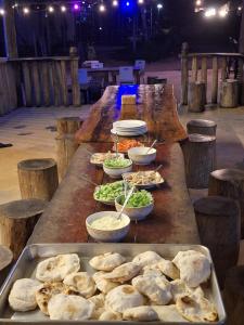 a long table with plates of food on it at Fat Monkey in Koh Rong Island