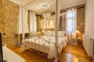 a bedroom with a swinging bed in a room at Stefanos House in Afitos