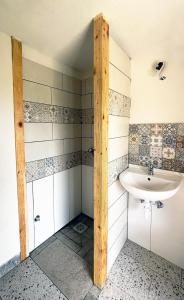 a bathroom with a sink and a toilet at Bungalow Volk Turjaški in Gabrovka