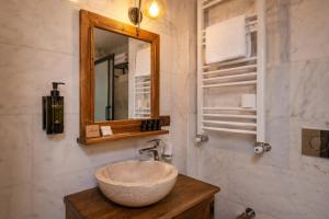 a bathroom with a bowl sink and a mirror at Mai Cappadocia in Göreme +22 photos