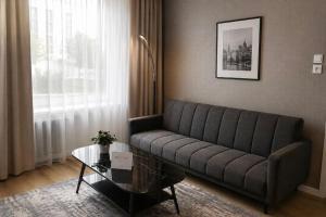 a living room with a couch and a coffee table at Modi Line Vee in Valga