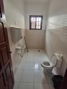 a bathroom with a toilet and a sink at Quarto Confortável no Centro - Bela Ilha House in São Luís +54 photos