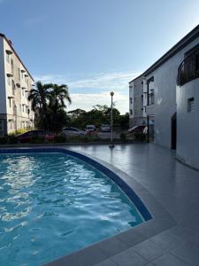 a swimming pool in the middle of a city at CJ's Travellers Room in Maribago