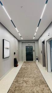 a large hallway with a carpet in a building at فندق شفت جازان Shift Jizan Hotel in Jazan
