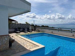 a swimming pool on the roof of a house at Villa Max in San Nicola Arcella +50 photos