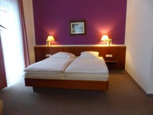 Ein Bett oder Betten in einem Zimmer der Unterkunft Hotel Dorotheenhof