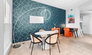 a dining room with a table and chairs at SPI Beach Condo - Just a block away to Paradise in South Padre Island