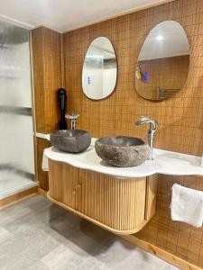 two sinks in a bathroom with two mirrors at The Tranquil Retreat Countryside Escape in Larkhall +68 photos