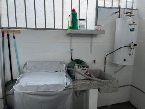 a hospital room with a bed and a sink at Residencial Granate Xochitepec Morelos in Atlacholoaya +10 photos