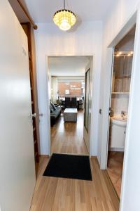a hallway leading to a living room with a couch at Hanseatic 204 in Duhnen