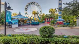 a amusement park with a ferris wheel in the background at Holiday Inn Express Houston Downtown by IHG in Houston