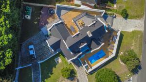 an overhead view of a house with a pool at Eden on Walton 1 in Sea Vista