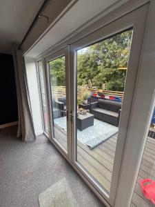 a sliding glass door leading to a patio at Nirvana house in Deepcar
