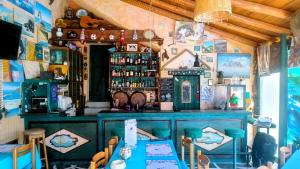 a bar with a blue counter in a room at Villa Rena in Batsi