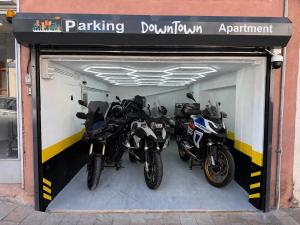 a garage with two motorcycles parked in it at Down Town Karpenhsi in Karpenisi