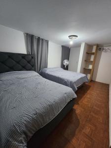 a bedroom with two beds and a ladder in it at Trajineras xochimilco in Mexico City