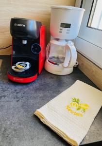 a coffeemaker and a coffee maker sitting on a counter at Blue Riviera in Roquebrune-Cap-Martin