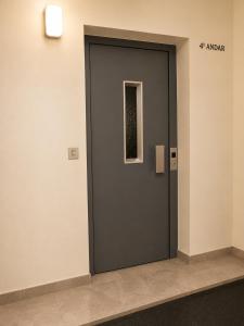 a black door in a building with a window at Espaço-Zero Downtown Porto in Porto