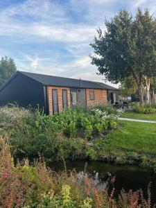 a house with a garden in front of it at Velthorst 6 in Warmond