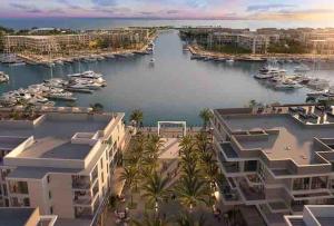 a view of a marina with boats in the water at Condo in Marassi Marina in El Alamein