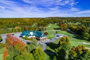 an aerial view of a resort with a large building at Foothills Lodge & Cafe in Malone