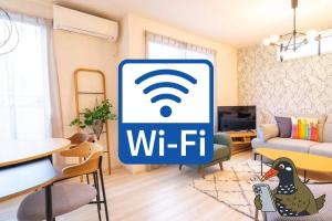 a living room with a wi fi sign in a room at OKINAWA BEACH HOUSE Golden Drop S in Yaka +50 photos
