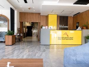 a lobby with a reception desk in a building at Asfar Hotel Apartments أسفار للشقق الفندقية in Muscat