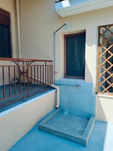 a stairway in a building with a window at Barefoot Nest in Nea Skioni