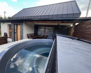 a plunge pool in front of a house at Przystanek Stodoła in Rajcza