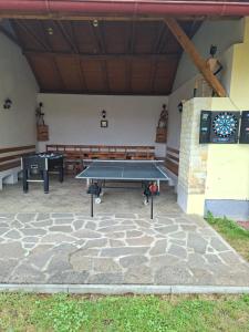a ping pong table in front of a building at Statek u Berků in Svatý Jan