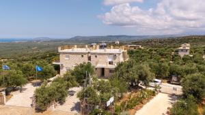 an aerial view of a building with trees at Anima Horizon - Thea apartment in Elaiófiton