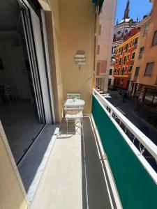 a balcony with a table on top of a building at Casa di Ale in Rapallo