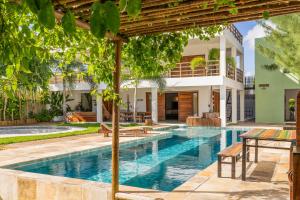 an image of a swimming pool in a villa at GreenHousi Boutique Preá in Prea