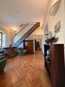 a living room with a staircase in a house at Relax on the Sea in Pizzo