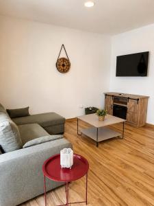 a living room with a couch and a table at Casa Pedro in Almodóvar del Río