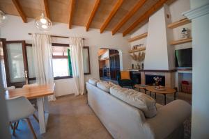 a living room with a couch and a table at Maricel in Cala Ratjada