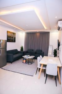 a living room with a couch and a table at روعة نجد المغرزات in Riyadh
