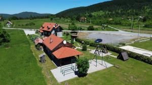 an overhead view of a house with an orange roof at MY WAY apartman i sobe in Saborsko