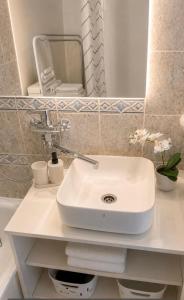 a bathroom with a white sink and a mirror at Modi Line Vee in Valga