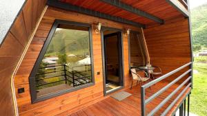 a view of the balcony of a tiny house at Sno Valley Cottage in Sno