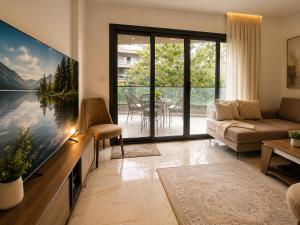 a living room with a large tv and a couch at Stunning view in Madinaty in Madinaty