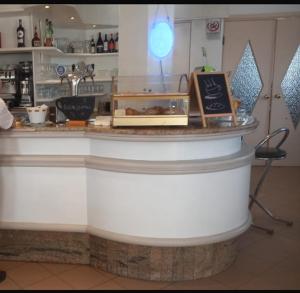 a counter in a restaurant with a counter top at La Voglia in Villanova sullʼArda