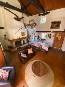 an overhead view of a living room with a table at Gîte de Calouze - 5 personnes in Gijounet