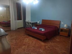 a bedroom with a bed and a table and chairs at Casa Regina in Dongo +30 photos