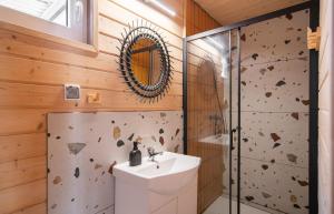 a bathroom with a sink and a shower at Domki Błękitne Nad Morzem Międzywodzie in Międzywodzie +32 photos